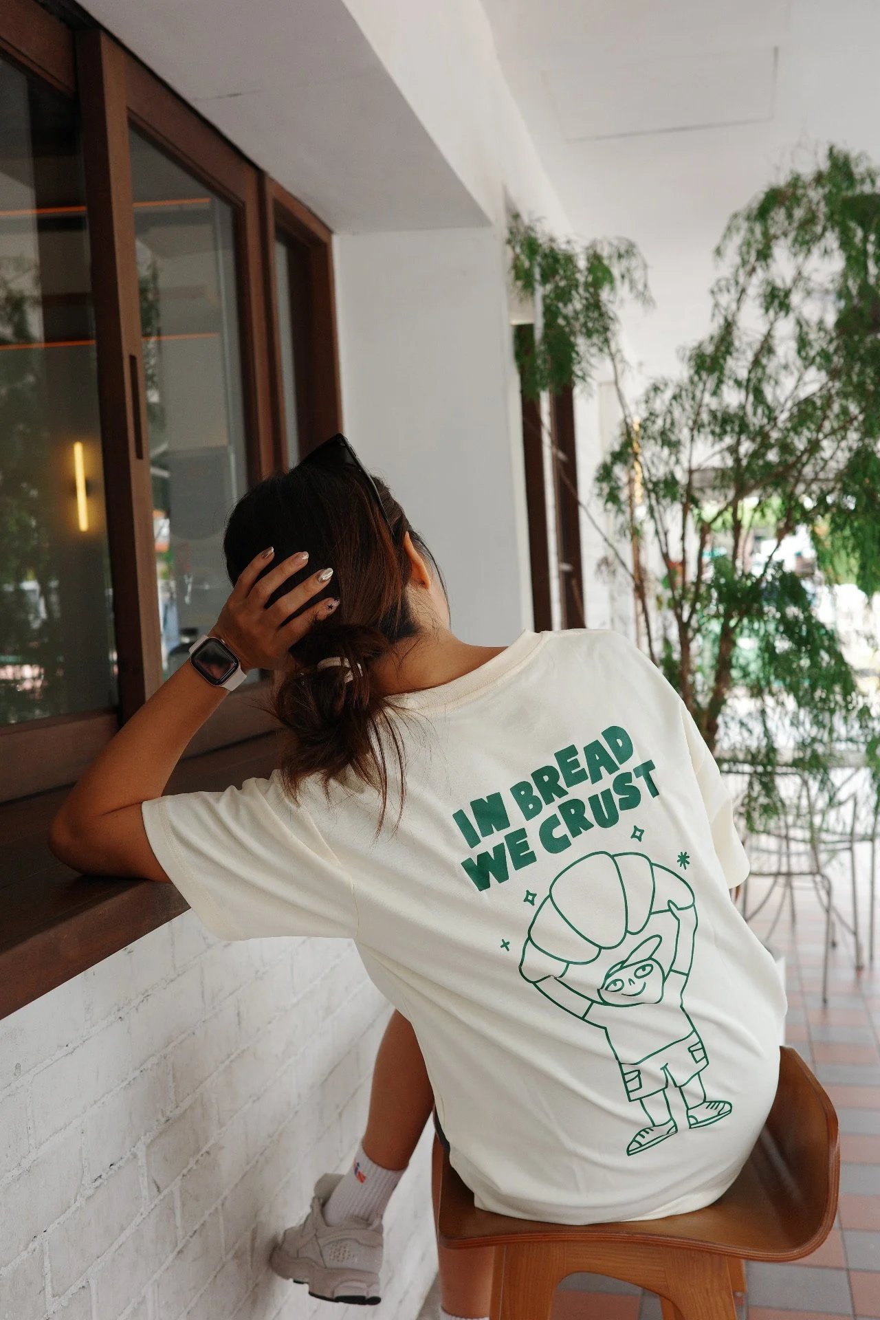 Back view of a cream In Bread We Crust graphic t-shirt, unisex casual streetwear tee