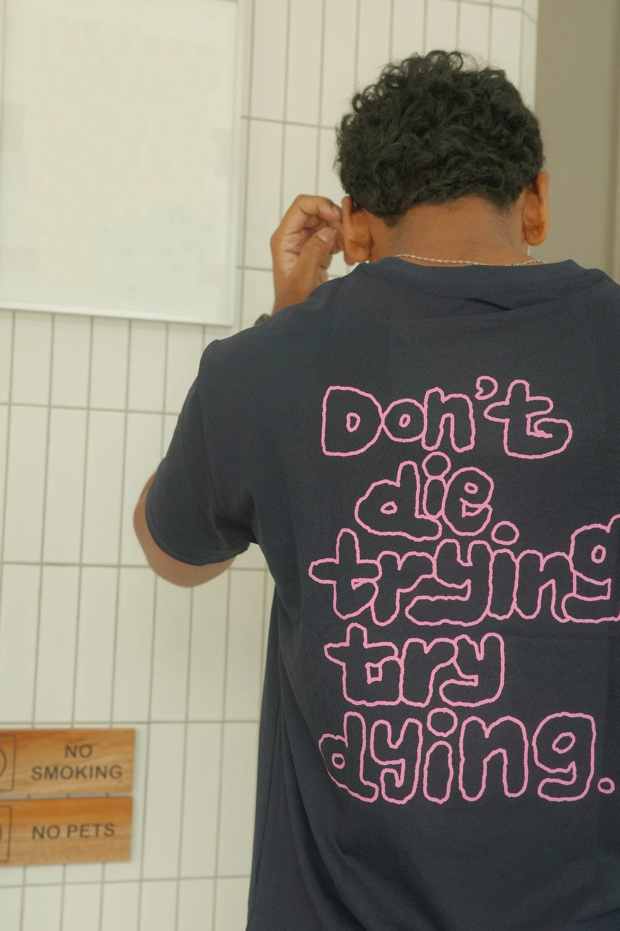 Back view of a navy Try Dying graphic t-shirt with pink details, unisex casual streetwear tee
