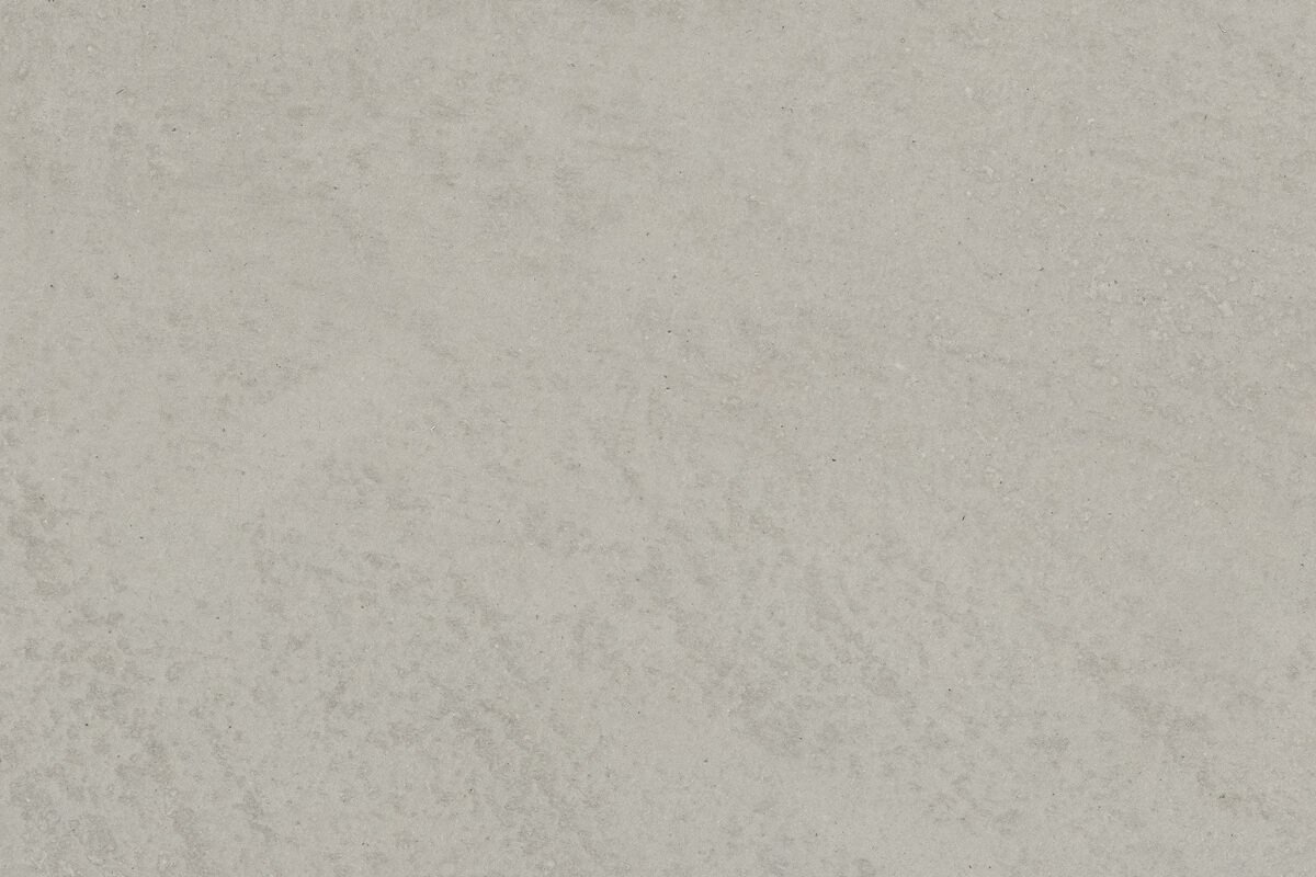 Une surface en béton beige avec une texture légèrement rugueuse.