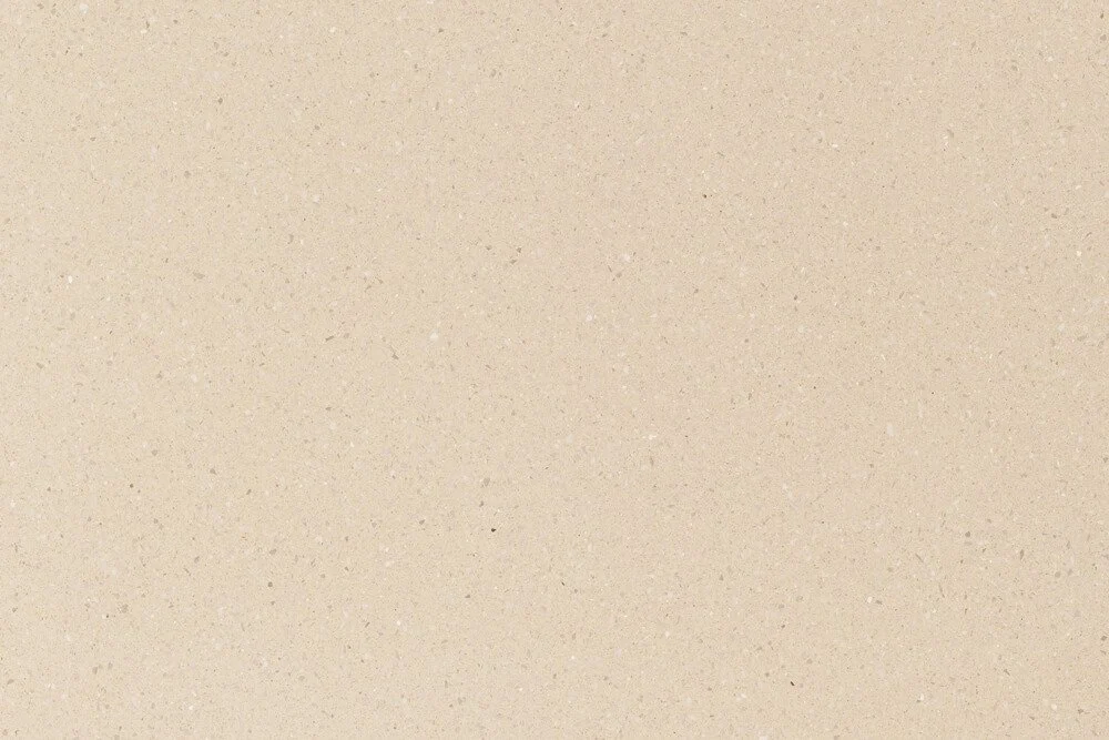 Surface de sable beige clair, fin et uniforme.