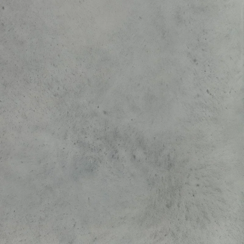 Surface en béton gris clair avec texture légèrement sale.