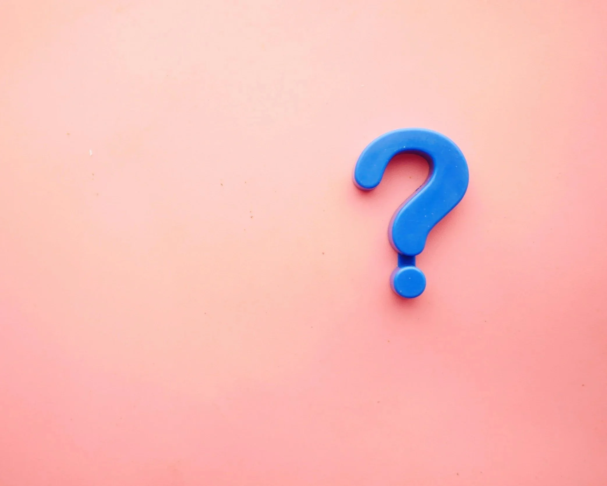 Blue question mark on pink background