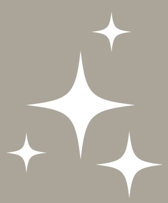 Four white sparkling star shapes on a gray background.