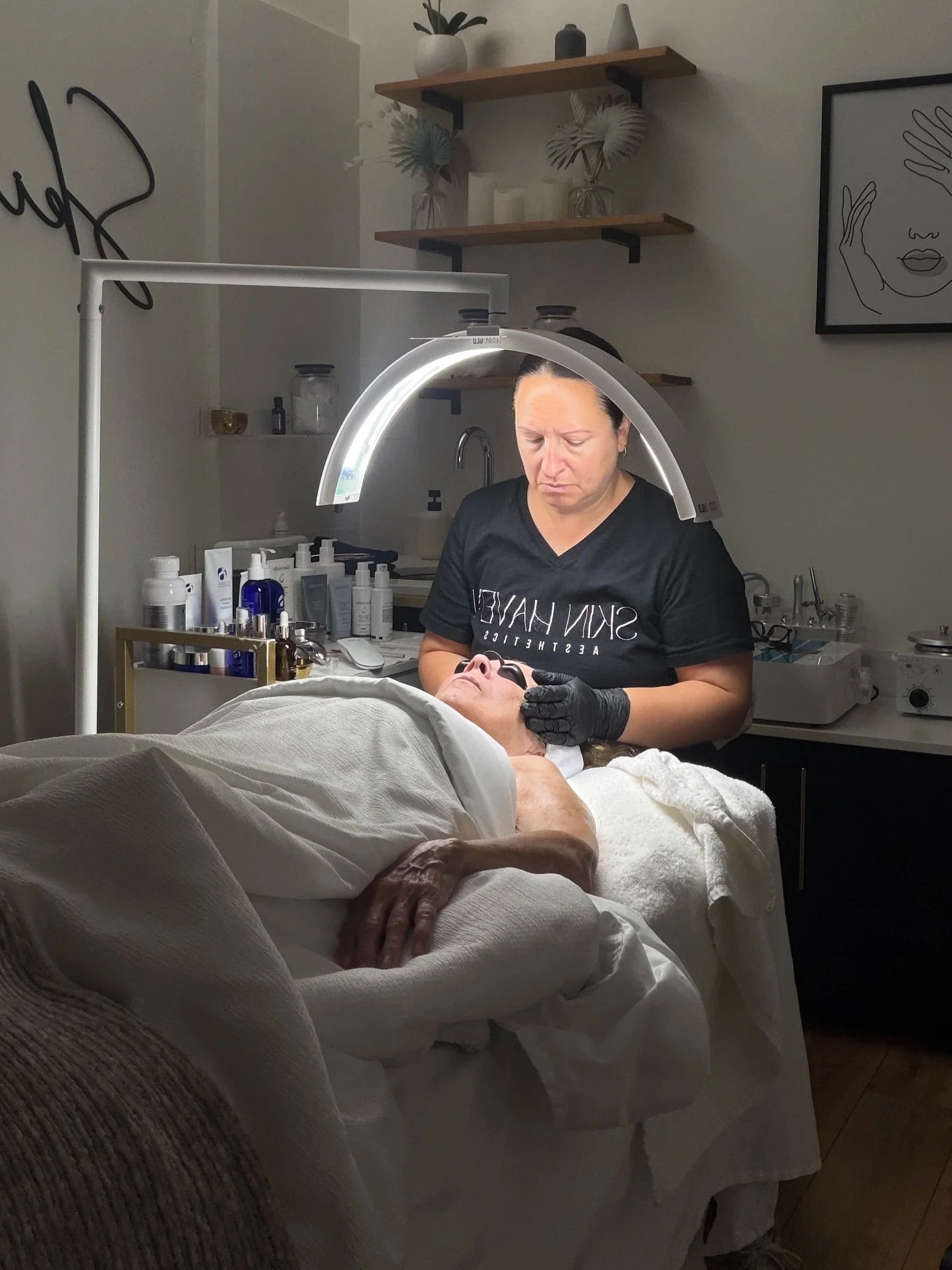 Licensed esthetician performing a customized facial at Skin Haven Aesthetics in Eatontown NJ