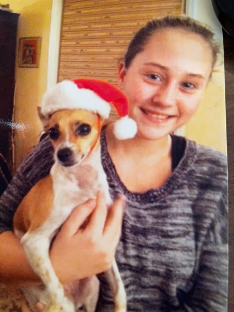 Sophia with the dog she prayed for Gita.