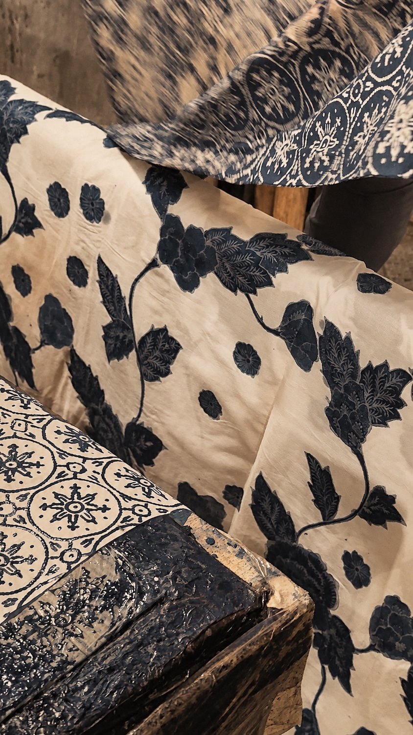 HYPATIA Batik Tulis - close-up of finished cloth - navy leaf-and-vine and medallion motifs, hand-drawn wax-resist batik on cream cotton.