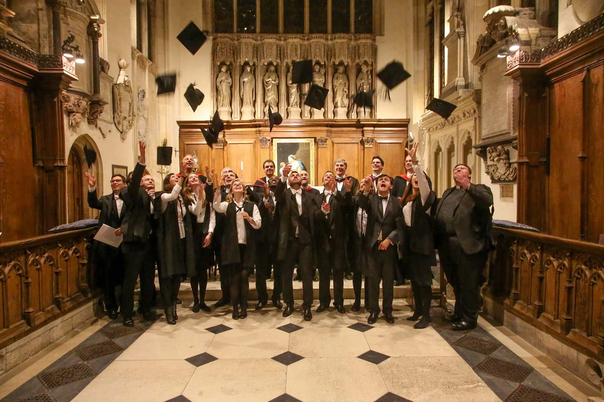 Elisha and his classmates at Wycliffe Hall, Oxford, throwing their caps