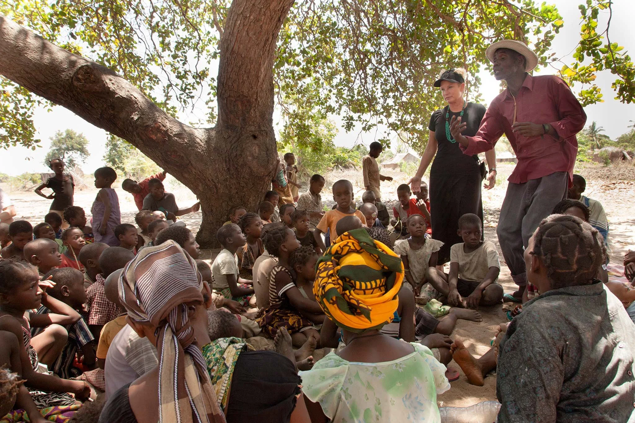 An animated interpreter tells Bible stories to the village