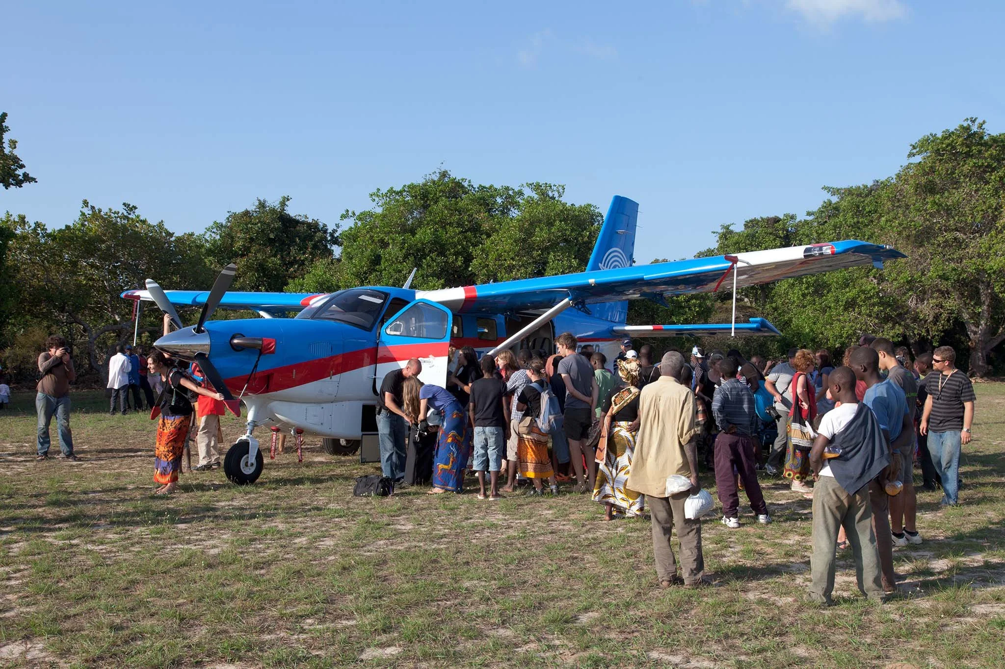 A crowd of our people gather to watch our departure