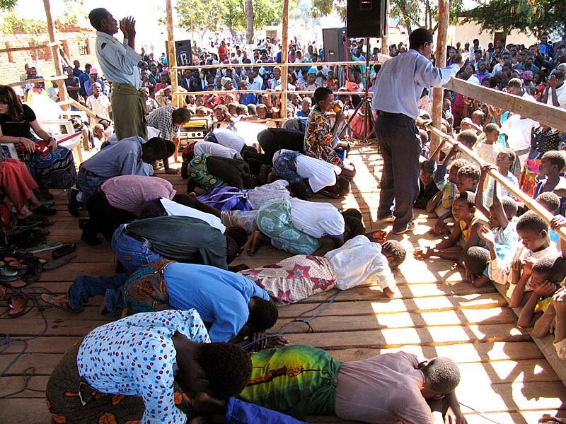 A conference worship team on their faces before the King