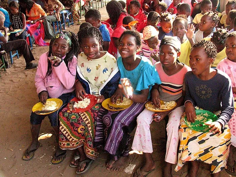 Girls at our Zimpeto Children's Center feasting during a conference. Our children can eat all they want!