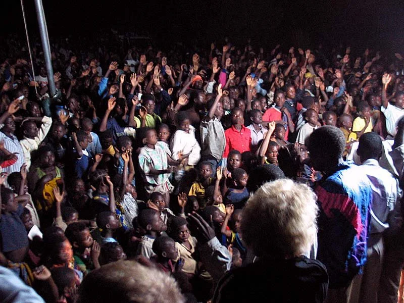 Everyone responds to the Gospel at Iapala, and then our pastors and visitors wade out among the people to pray for them.