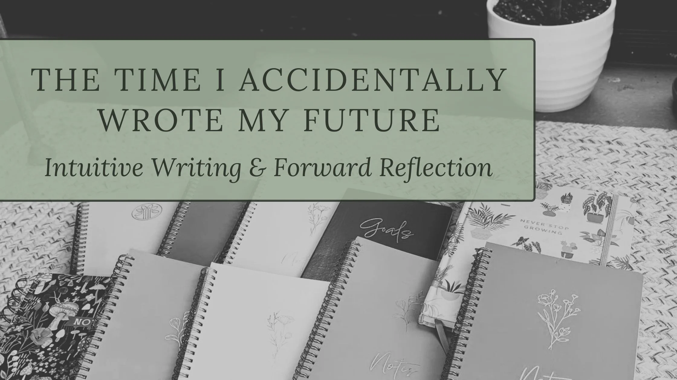 Handwritten journals stacked together, representing intuitive writing and forward-facing reflection used to map a future year