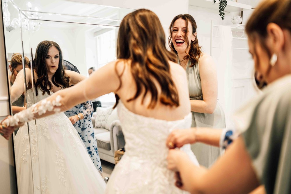Bride with her bridesmaids during morning preparations