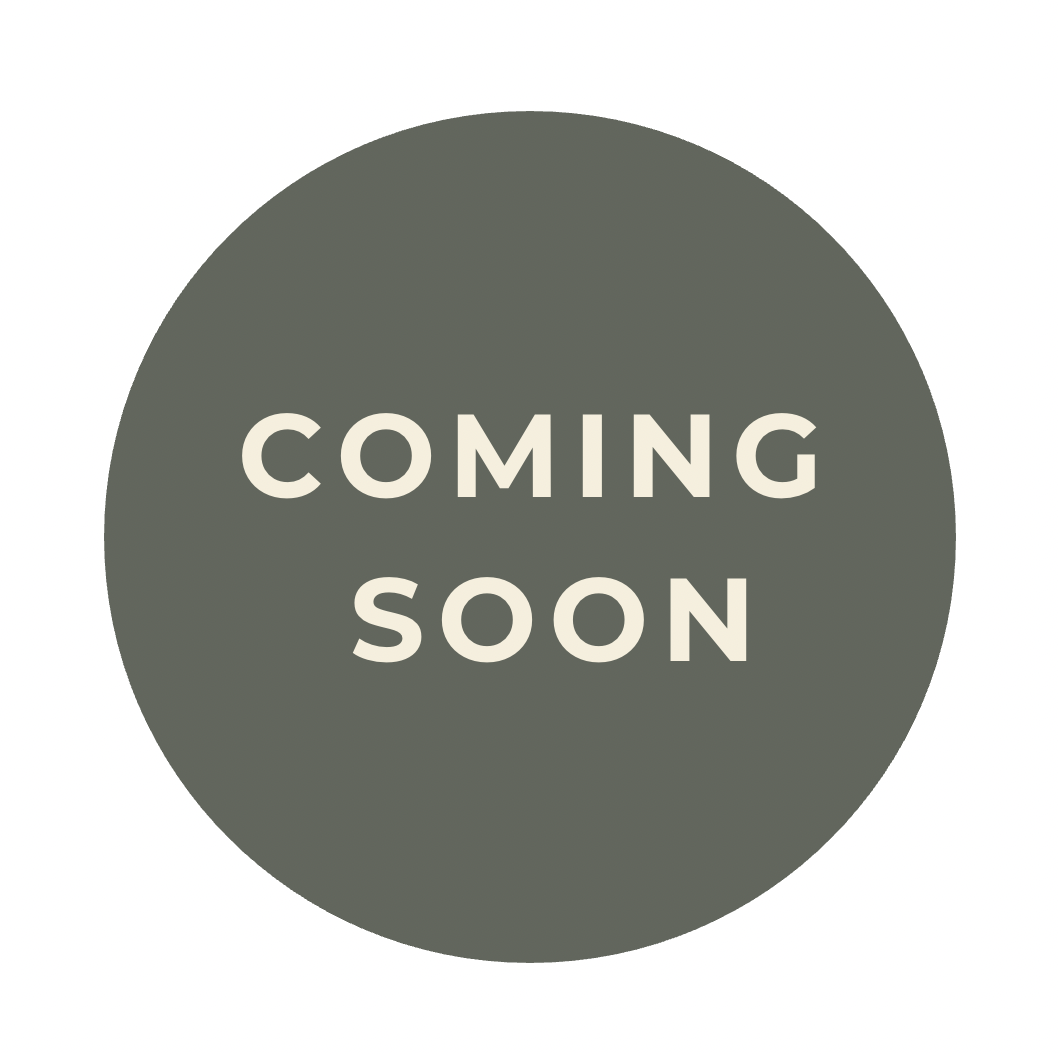 A dark gray circular graphic with white text that reads 'Coming Soon'.