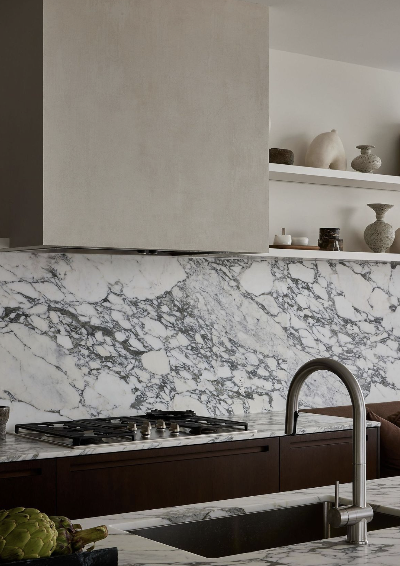 Close view of a honed marble countertop with a smooth matte finish