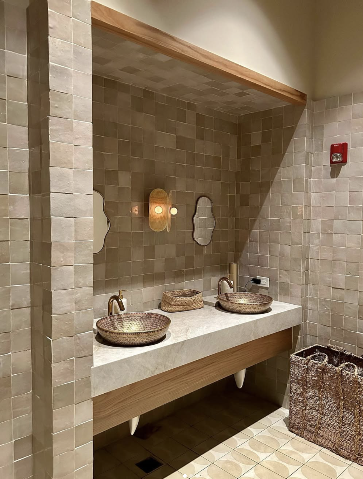 Luxury kitchen backsplash featuring Zellige Tile Studio’s glossy white Moroccan tiles, paired with gold hardware.