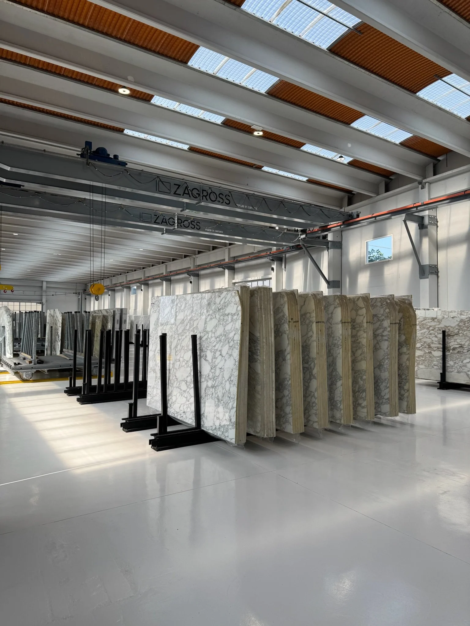 Sequential natural stone slabs from the same stone bundle displayed together.