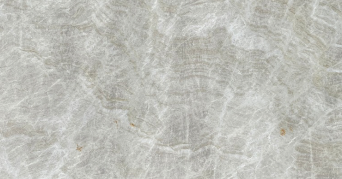 Close-up of a marble surface with light beige and white tones.