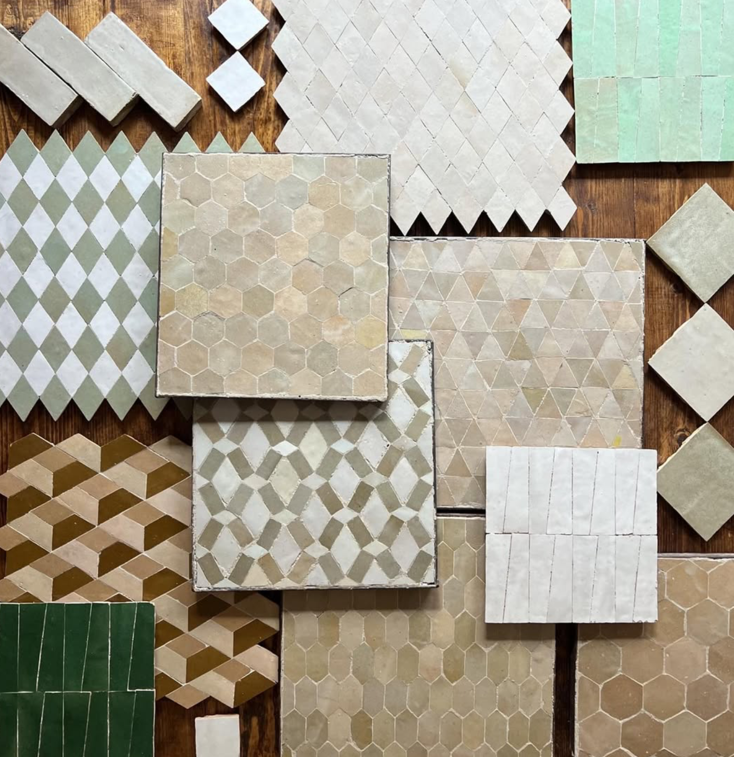 Close-up of handcrafted Moroccan Zellige tiles in soft neutral tones, showcasing organic texture and artisanal variation
