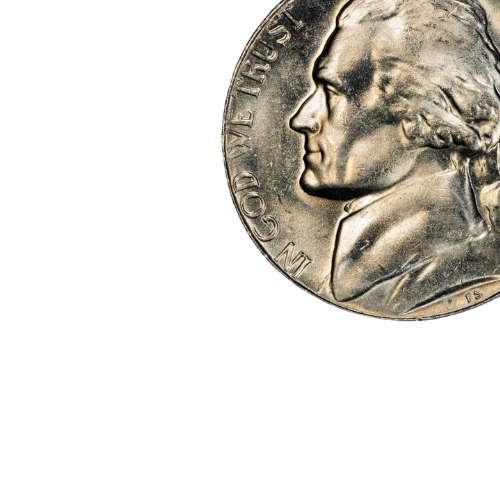 close up image of a jefferson nickel in god we trust silver colored coin