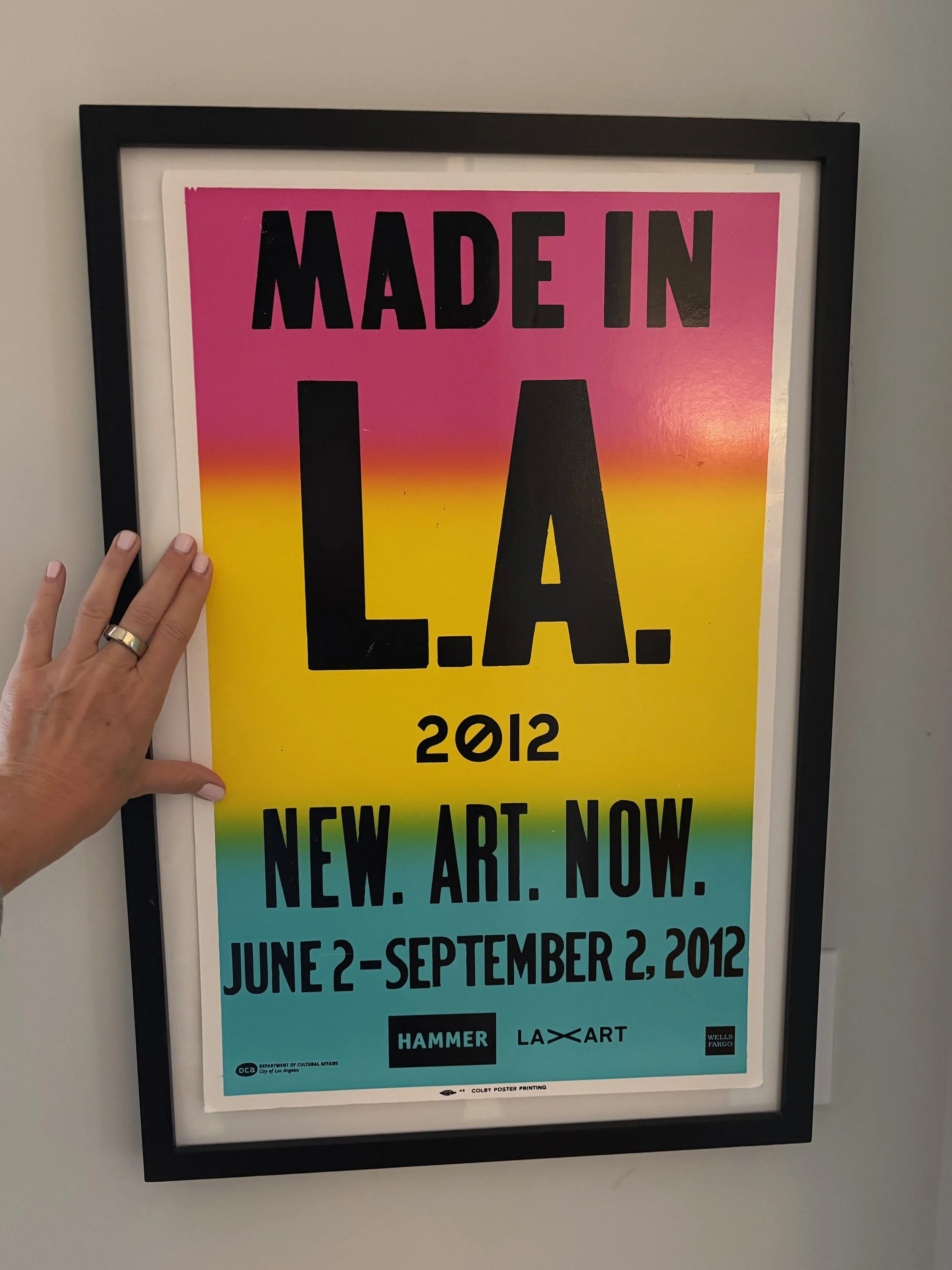 Colorful poster advertising 'Made in L.A.' art event from June 2 to September 2, 2012, with the tagline 'New. Art. Now.' and logos of Hammer Museum, LA Art.