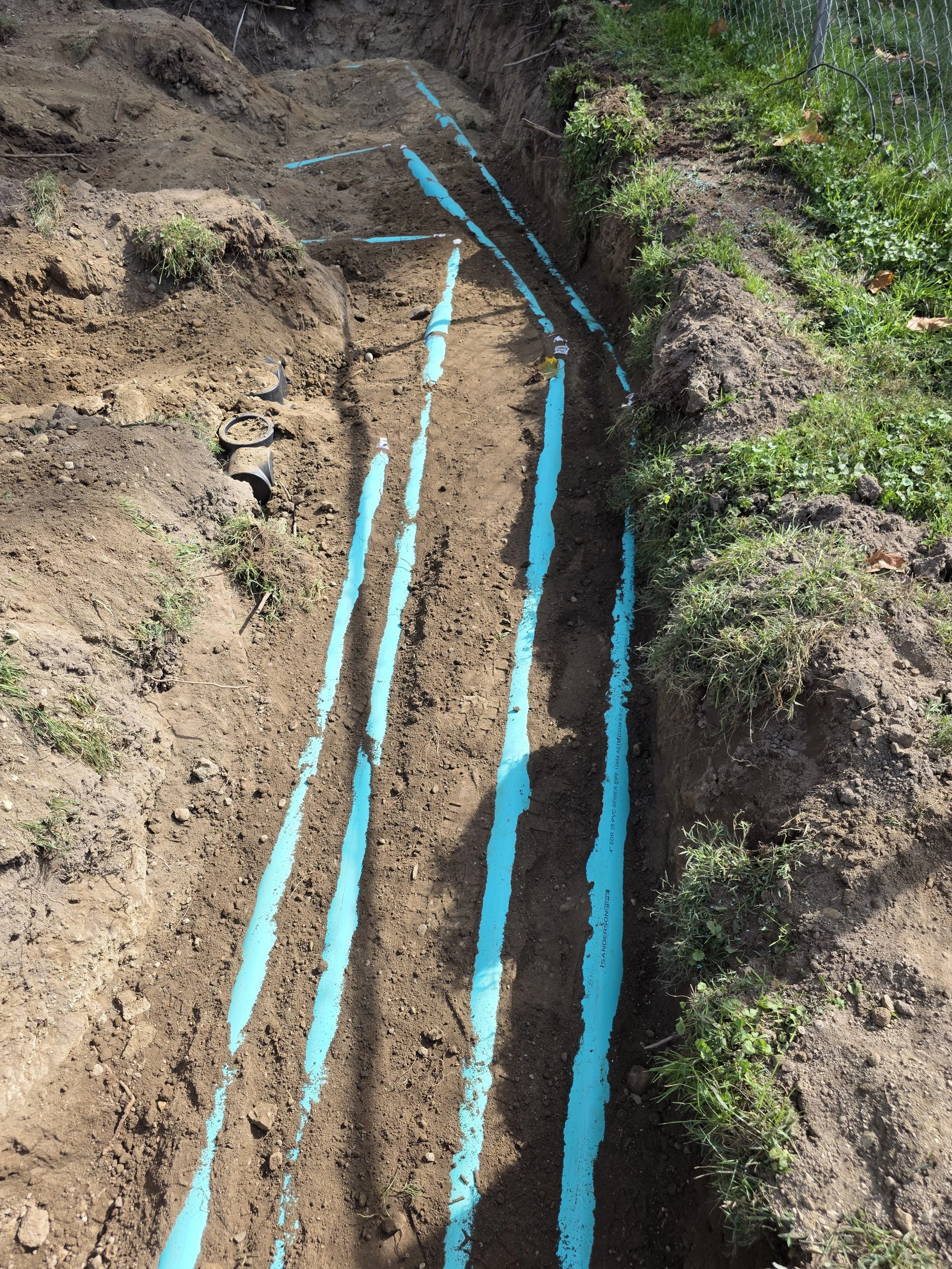 septic line layout preparation marked in excavation trench