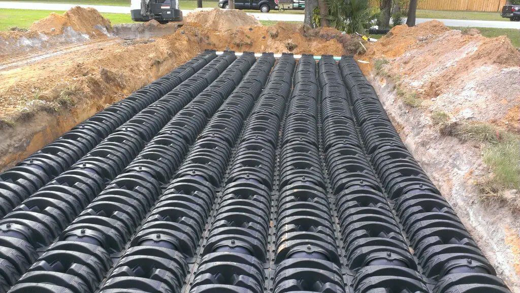septic drain field installation with chamber system placed in excavated area