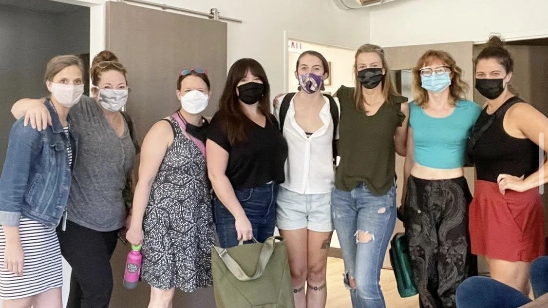 Group of 8 women wearing masks gather for doula event