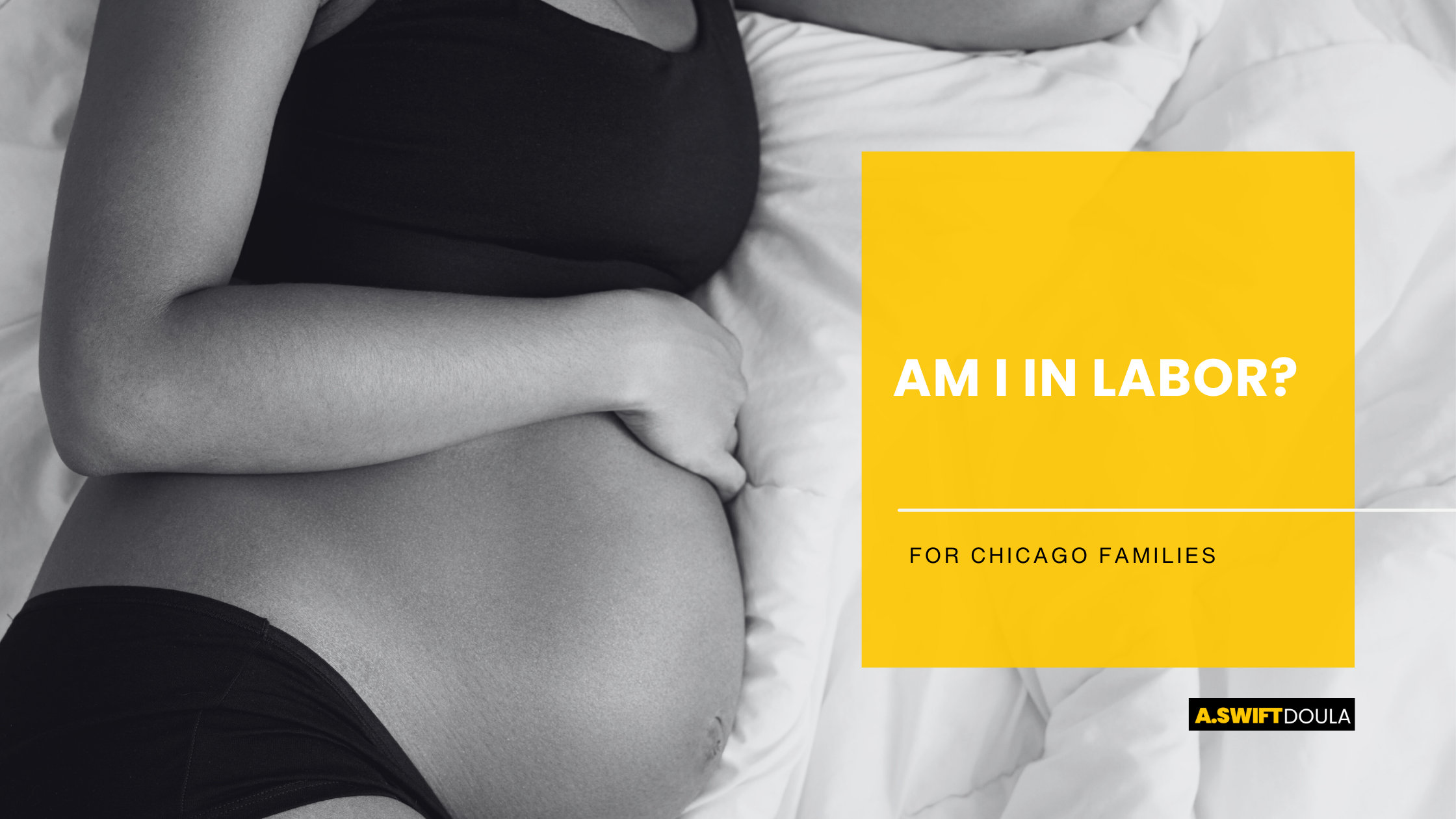 Pregnant woman laying down, image only of belly and black sports bra and underwear