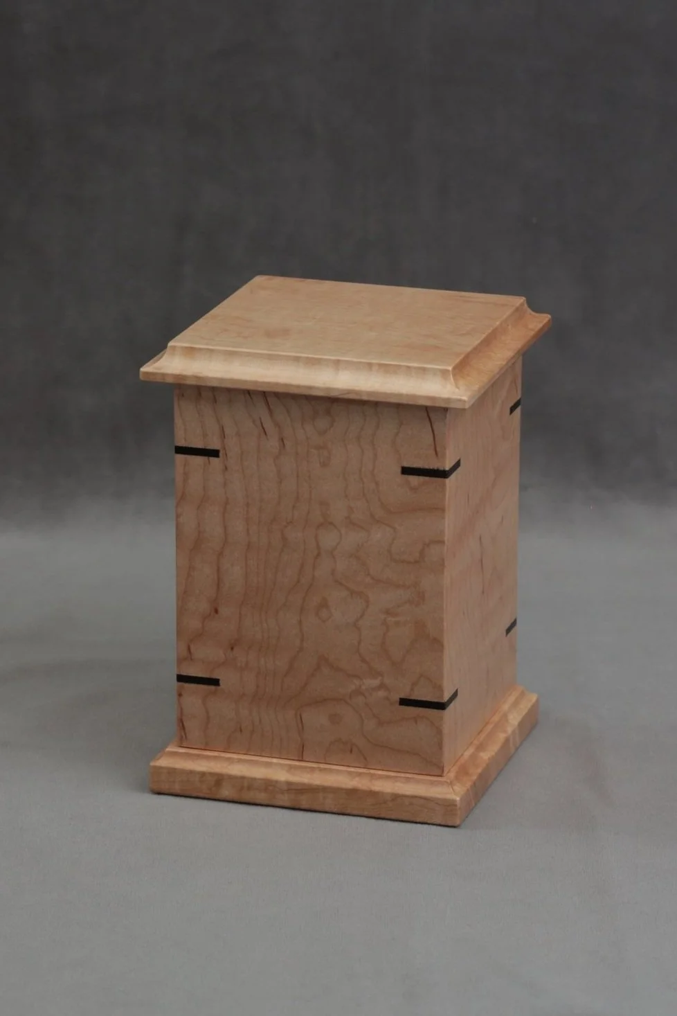 small wooden urn with wooden spline details