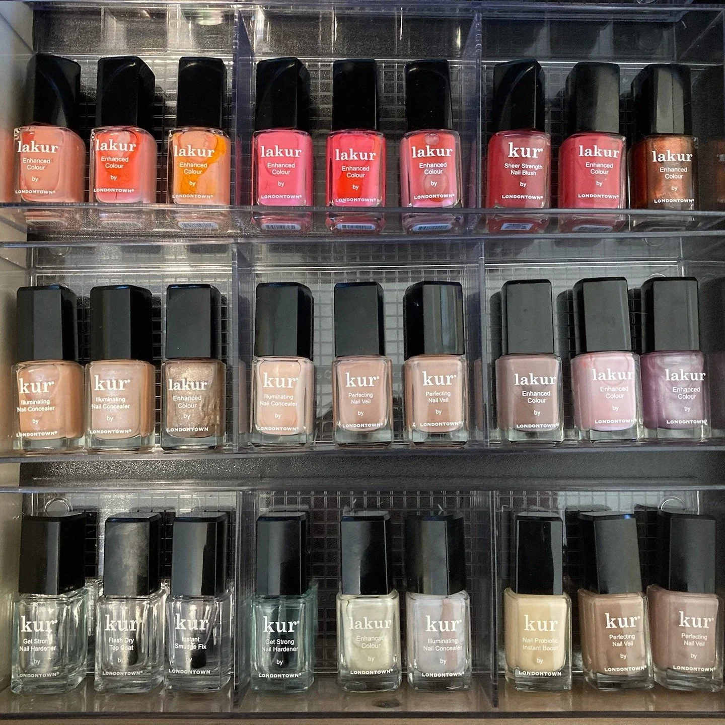 tray of organized nail polish bottles