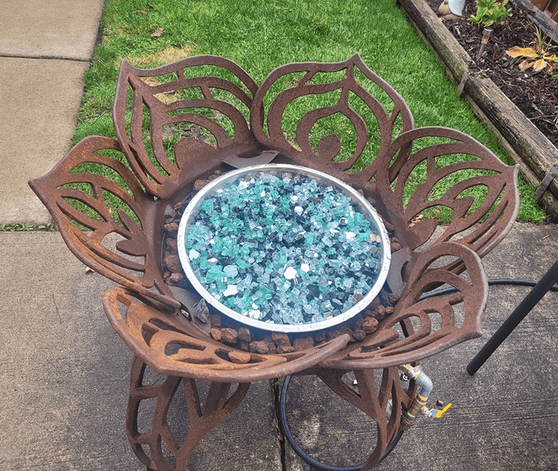 Minx's fireplace with glass and lava rock