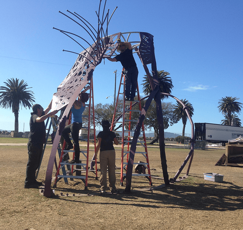 Crew assembling scales onto Illumacanth on Treasure Island, CA, 2016