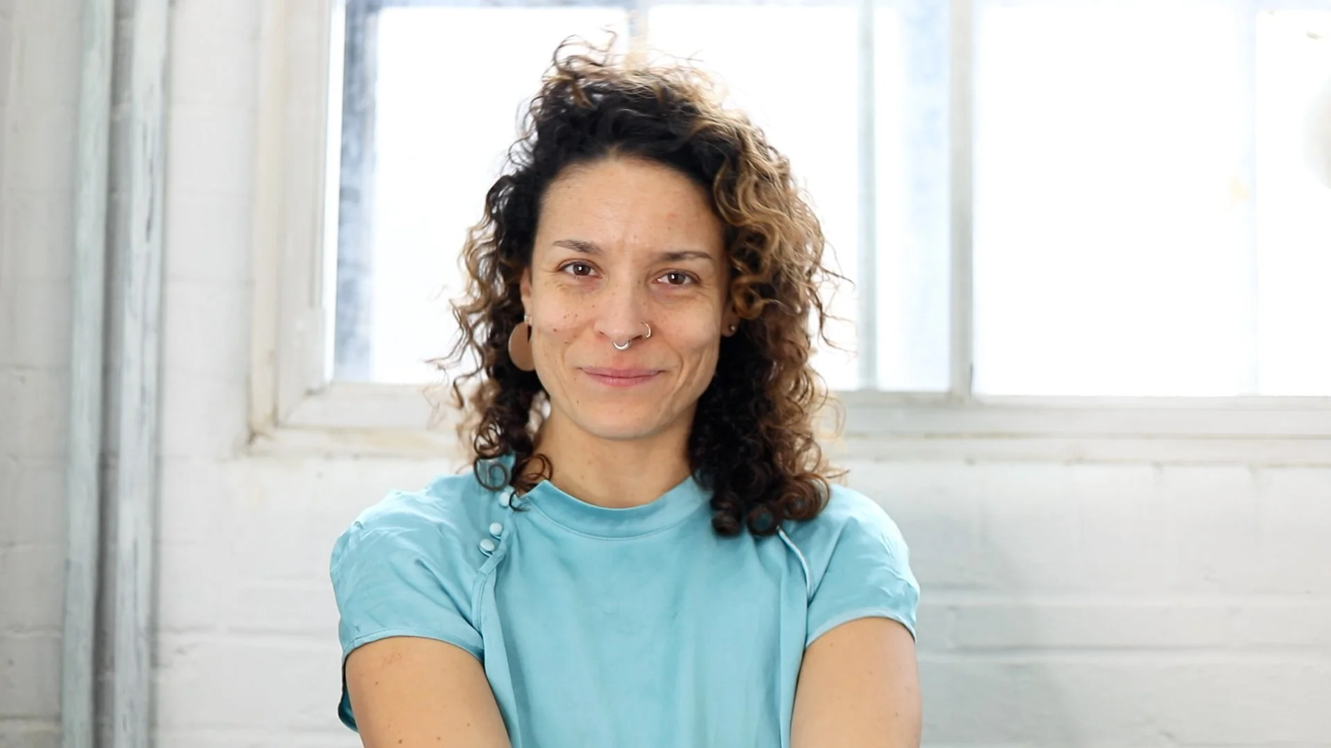 Photos of a woman with curly hair smiling at the camera