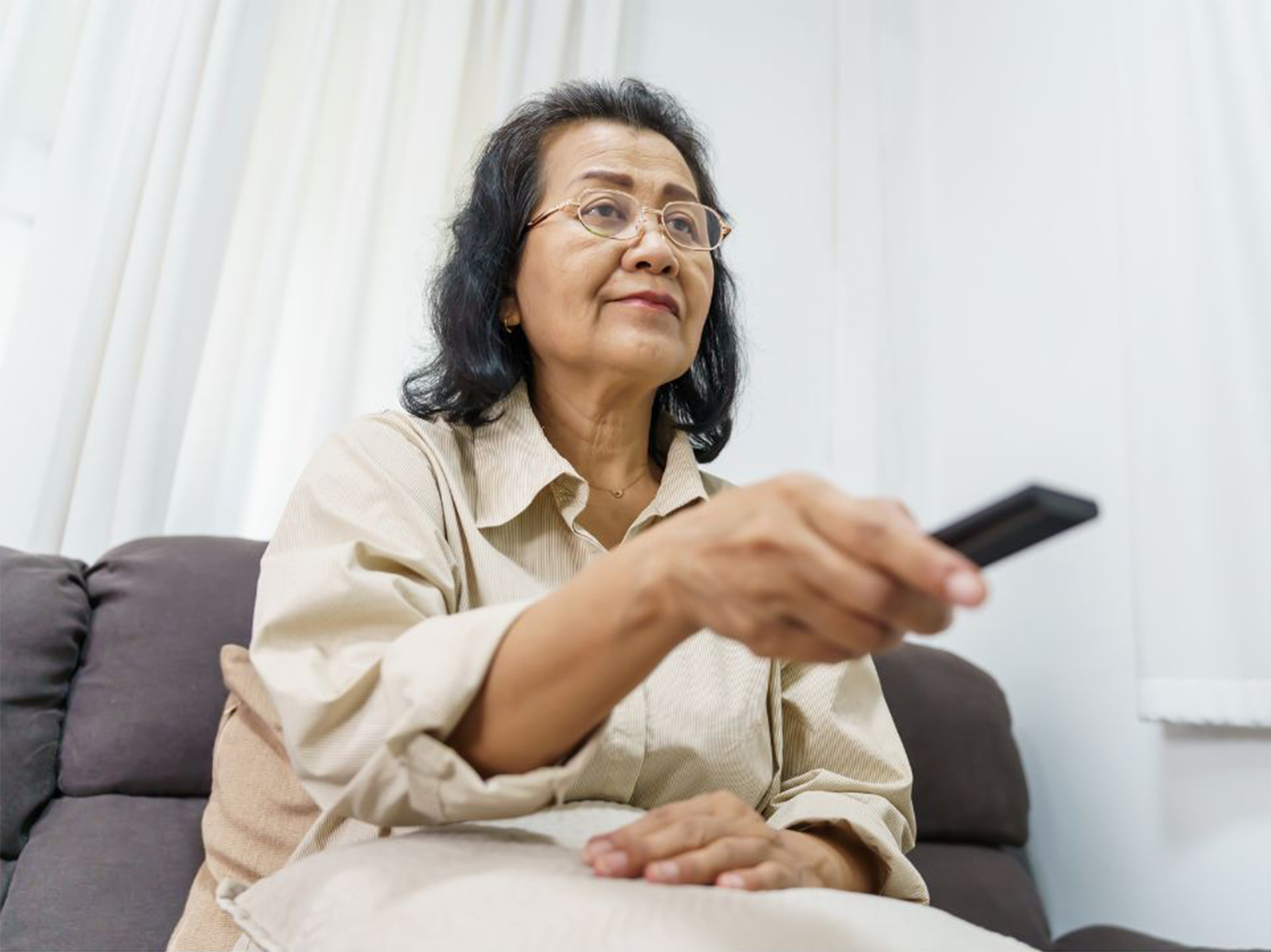 Older woman watching TV