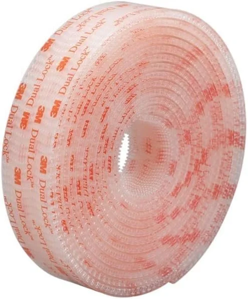 A roll of transparent double-sided tape with orange branding and text.