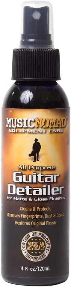 A 4 fl oz bottle of Music Nomad All Purpose Guitar Detailer, a cleaning spray for matte and gloss guitar finishes, with a black spray cap and label showing a person carrying a guitar silhouette.