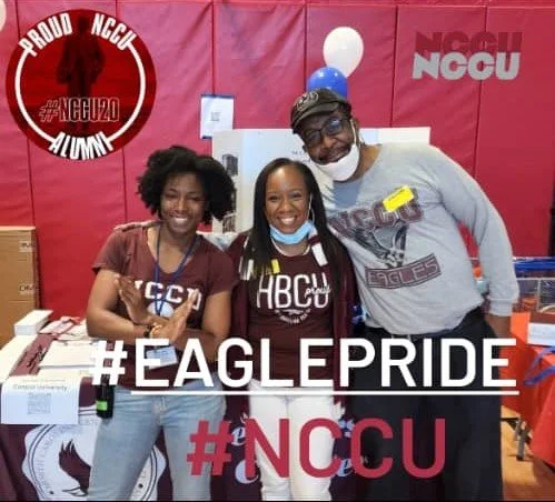 Three people standing together at an NCCU event, smiling, with NCCU banners and decorations in the background, and text overlay reading #EaglePride and #NCCU.
