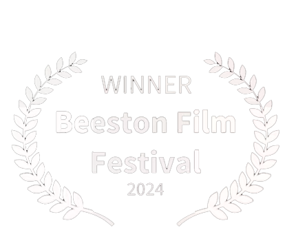 Award badge with laurel wreaths and text indicating winner of the Beeston Film Festival 2024.