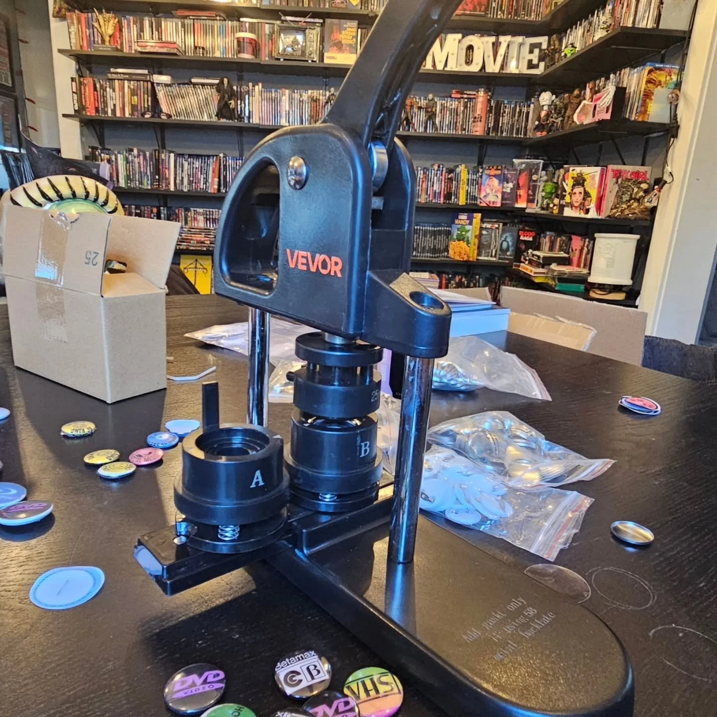 Having a blast designing and pressing retro VHS and physical media inspired pins! We'll have these at @moonlightmarketli next Saturday and @nysolarfaire on the 13th! We have 1 inch and 1.25 inch varieties. Are there any other designs we should make?
