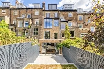 The rear elevation tells the story of this build better than any drawing could.
What was once a dark, disconnected mid-terraced with mismatched windows, exposed plumbing and an awkward floor layouts is now a light-filled, fully reconfigured five-stor