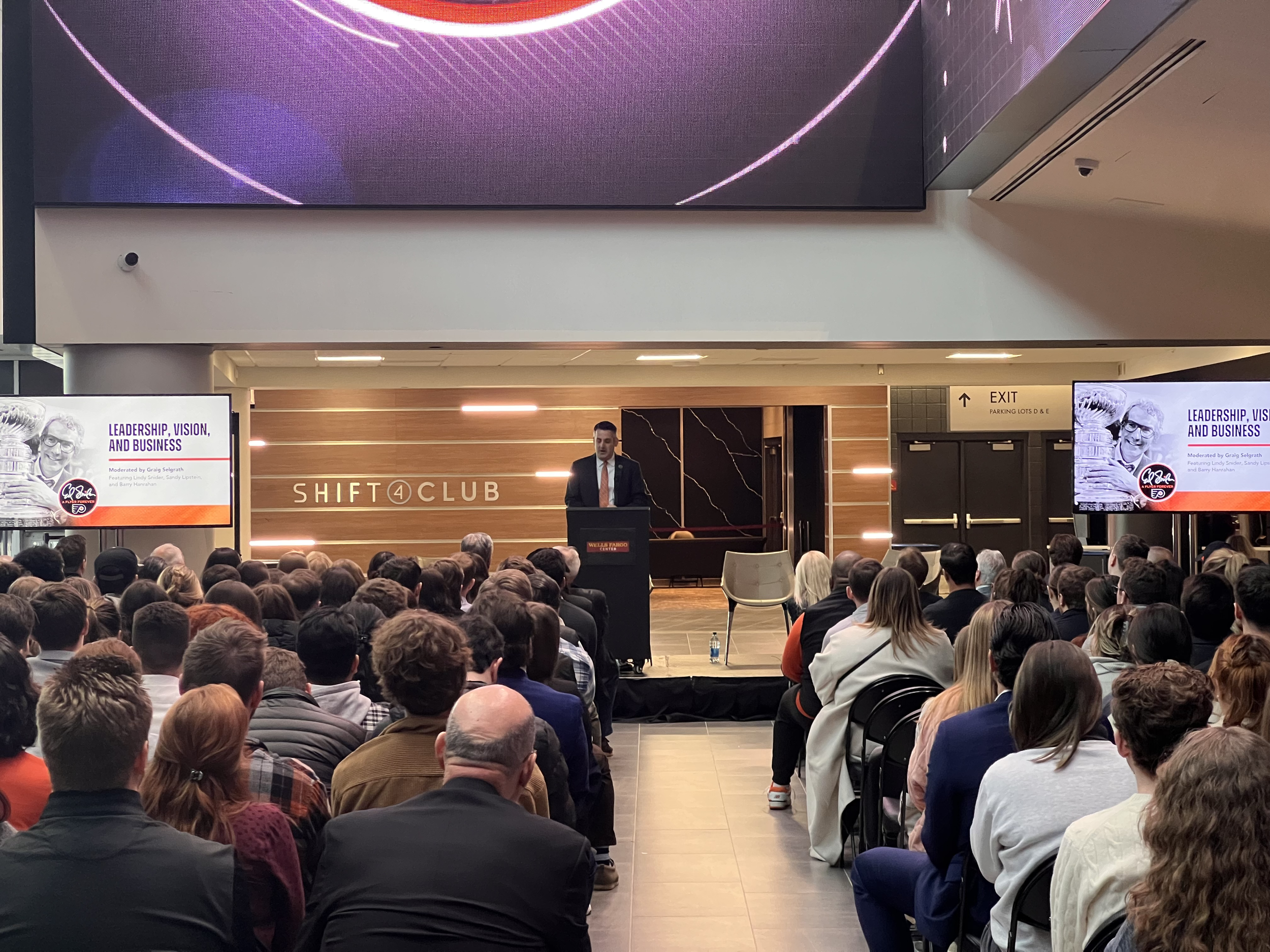 a corporate meeting with an audience and presenter