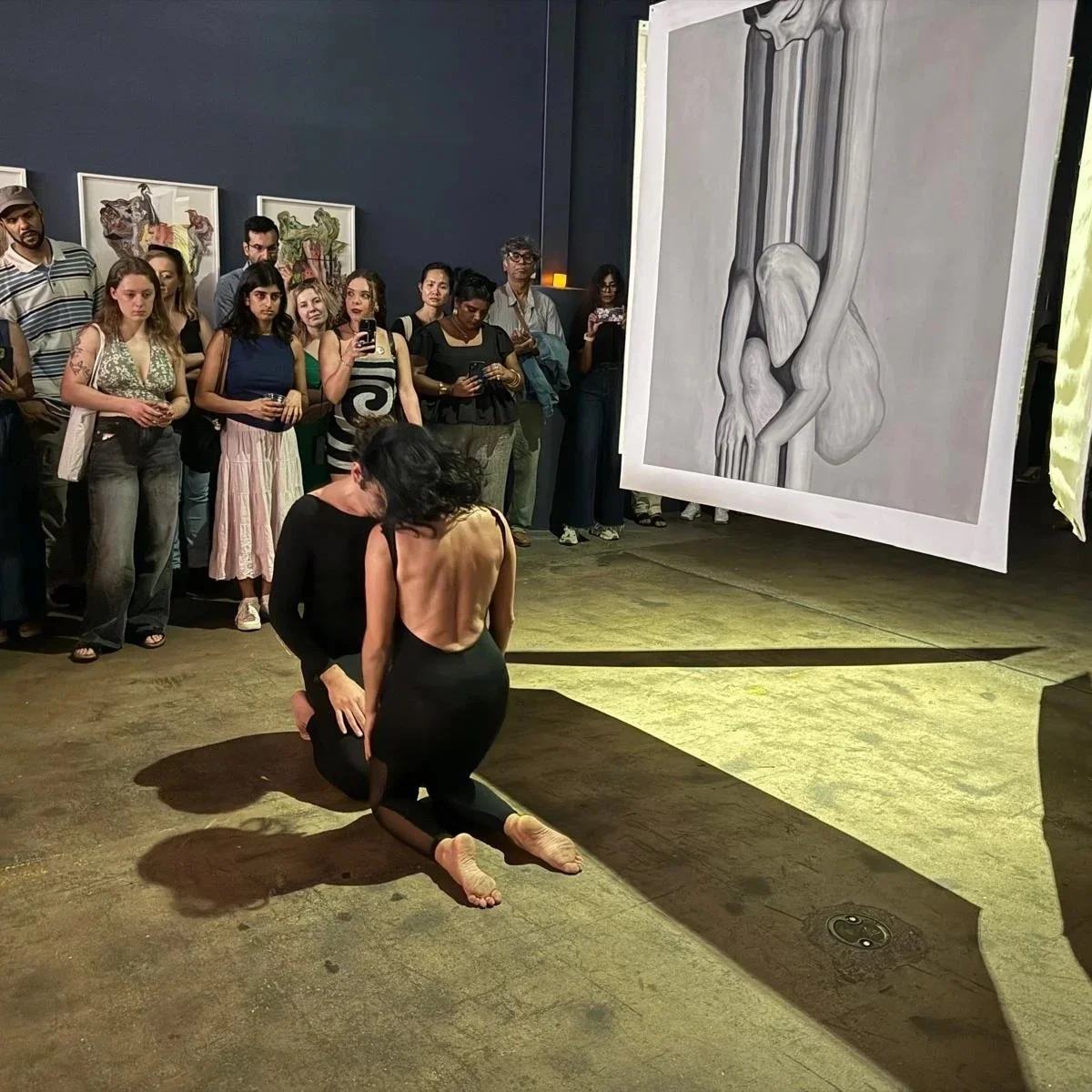 Florence Benichou and Jacopo Arrighi perform in front of Qinza Najm's work