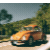 Orange Volkswagon Beetle zooming