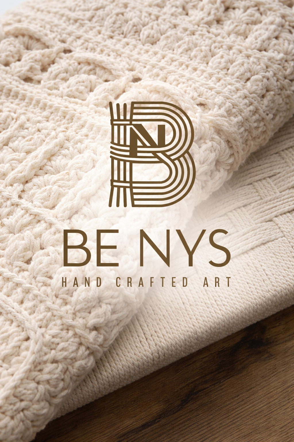 Close-up of cream-colored, hand-crafted crocheted and knitted textile items with the logo 'Be NYS Hand Crafted Art' overlayed