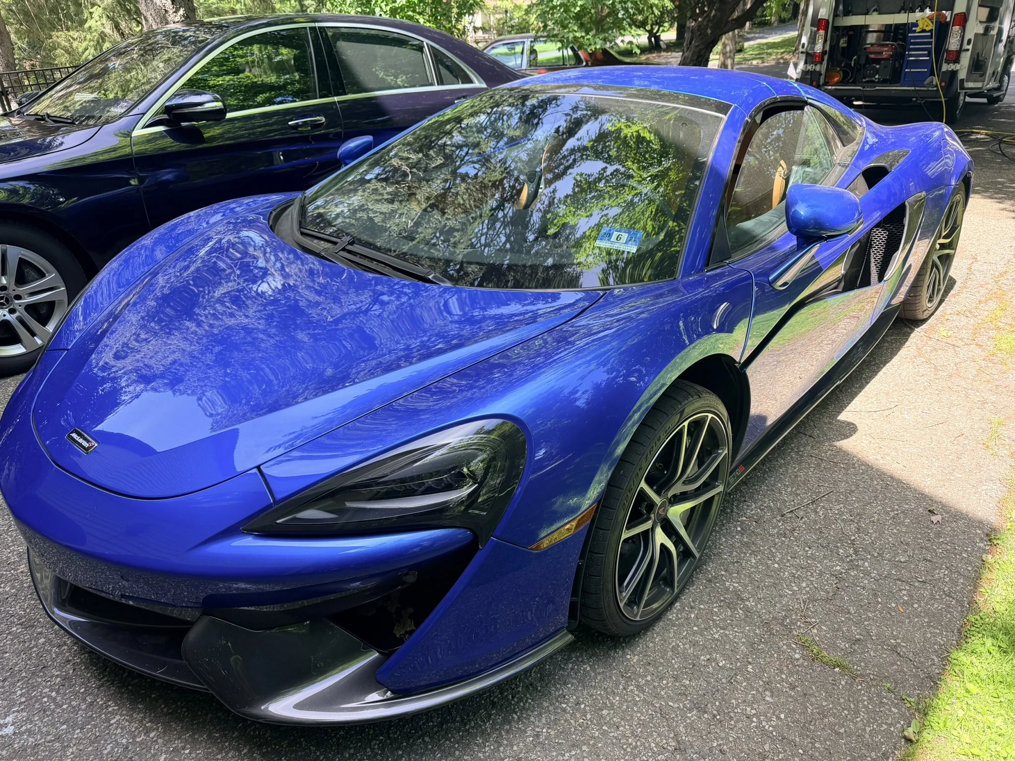 Blue McLaren Artura supercar professionally detailed for maximum gloss and presentation.