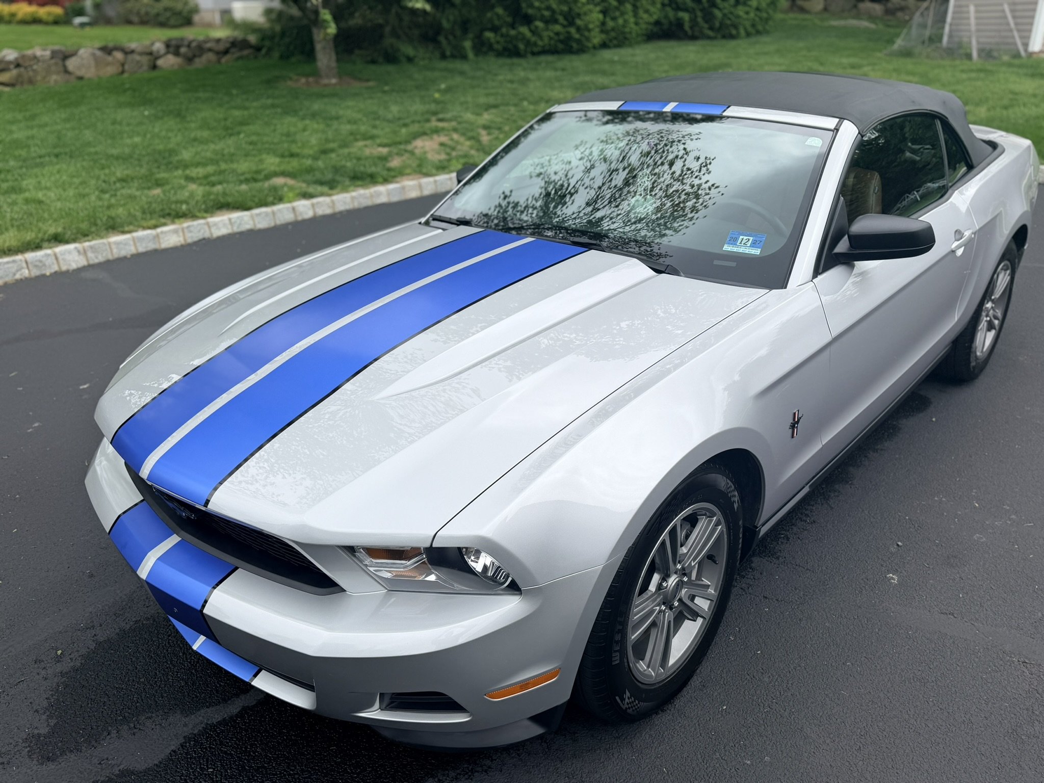 Exterior detailing service on Ford Mustang convertible.