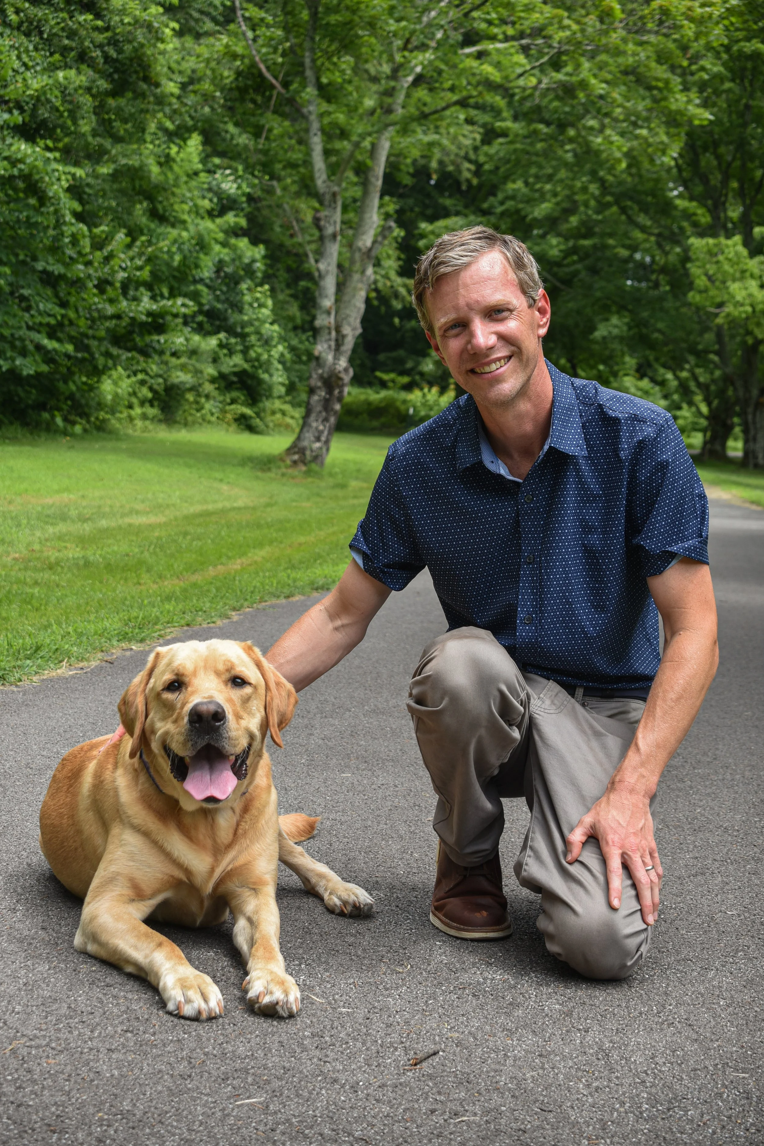 Rich Doyle with Buddy, his certified therapy dog at Inner Compass Counseling & Wellness in Annapolis, Maryland