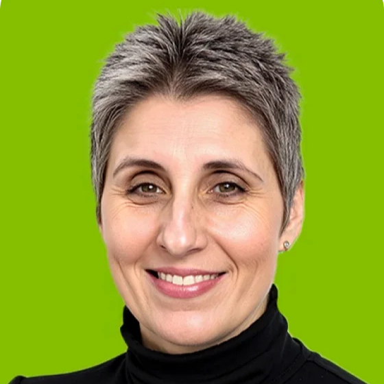 A woman with short dark hair and a black turtleneck.